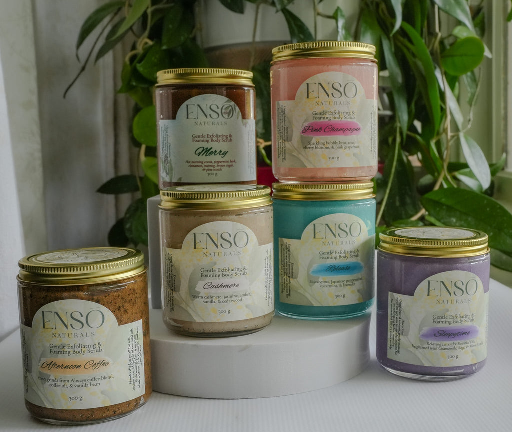 Gentle foaming sugar scrub jars with gold lids, assorted scent colors in glass containers