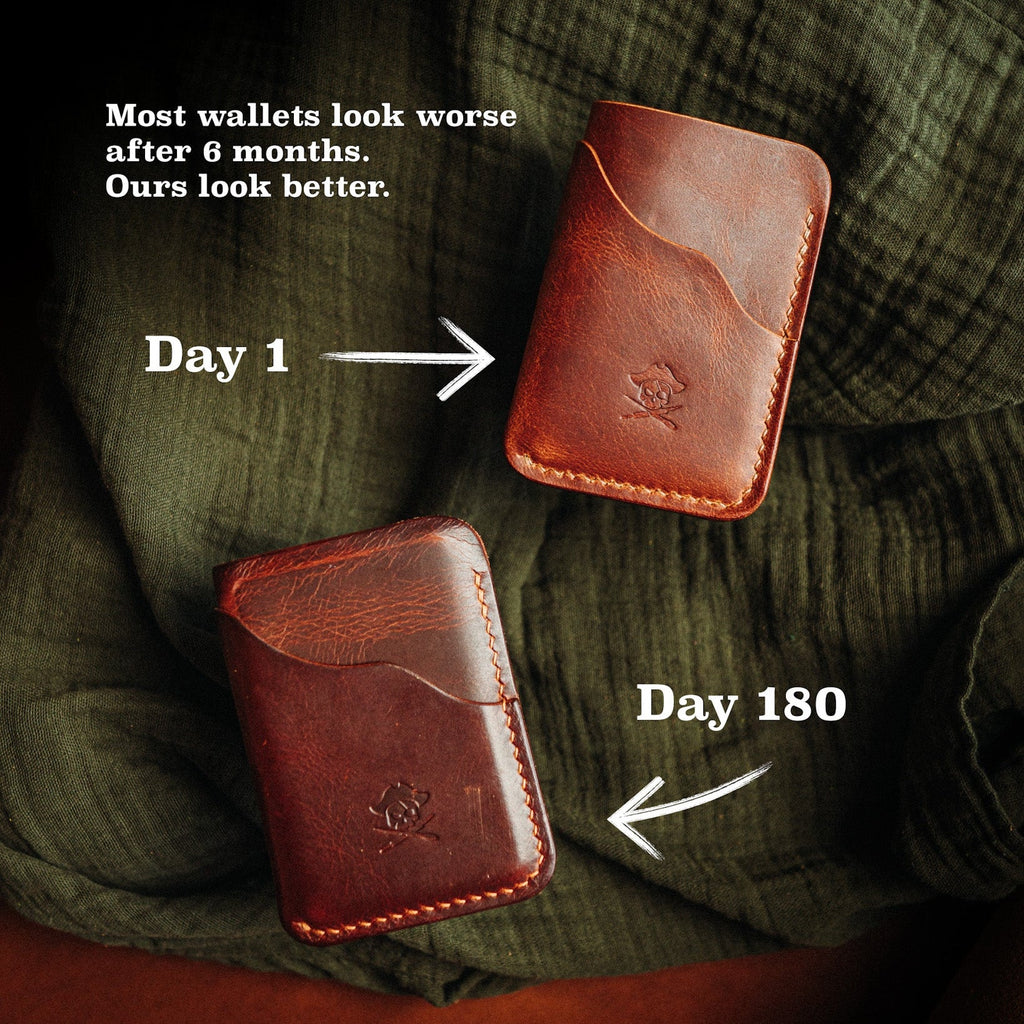 Red-brown minimalist leather wallet, front view with embossed logo and curved top panel