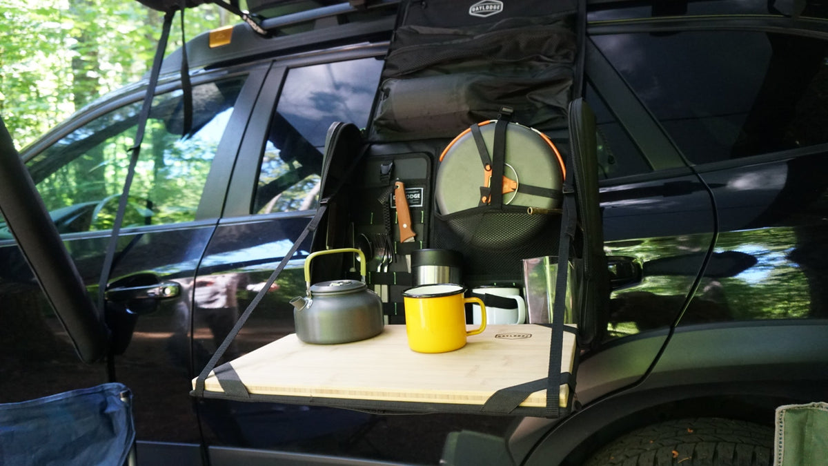 Green mobile camp kitchen bag with zip front panel and countertop storage