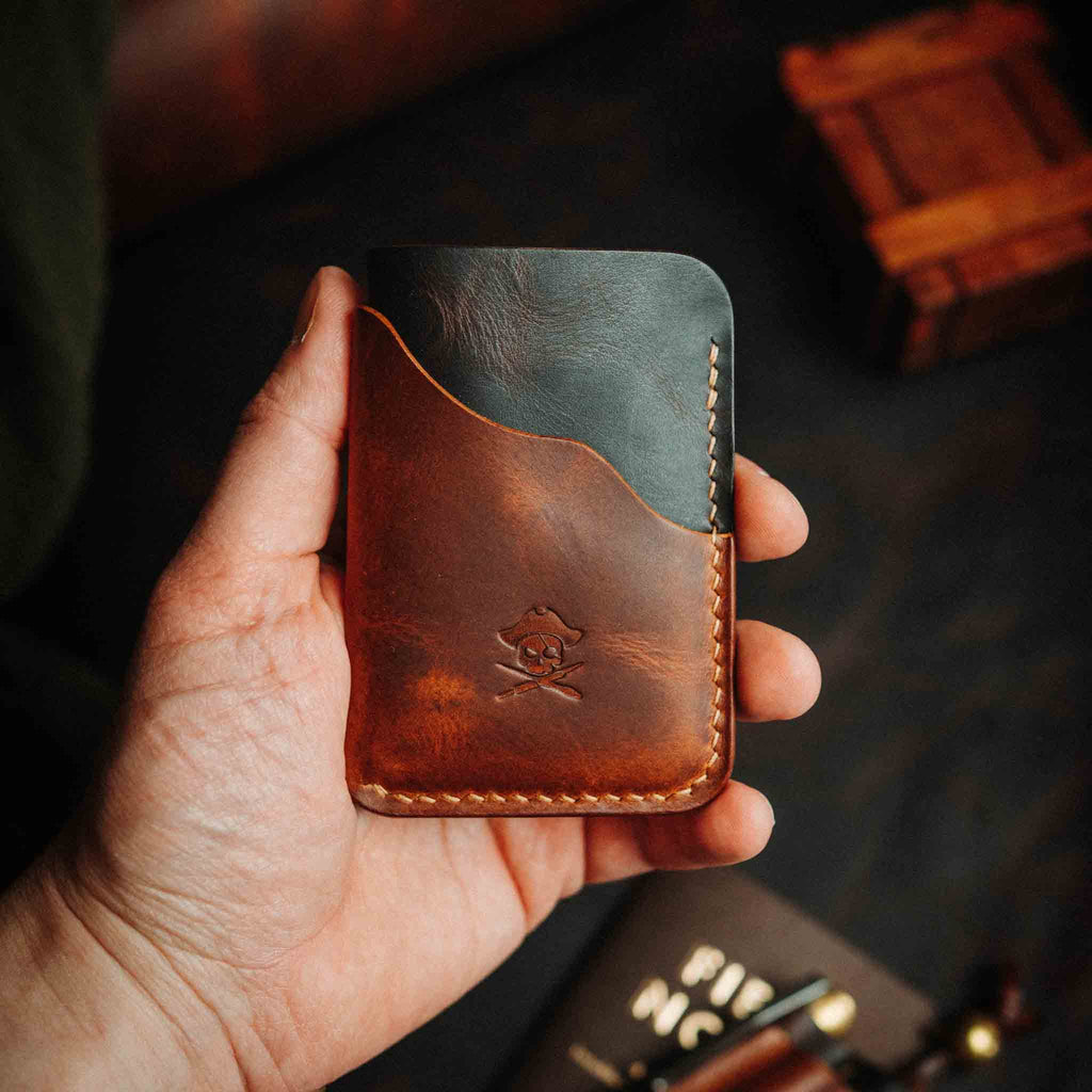 Brown minimalist leather wallet with embossed logo and contrast edge stitching