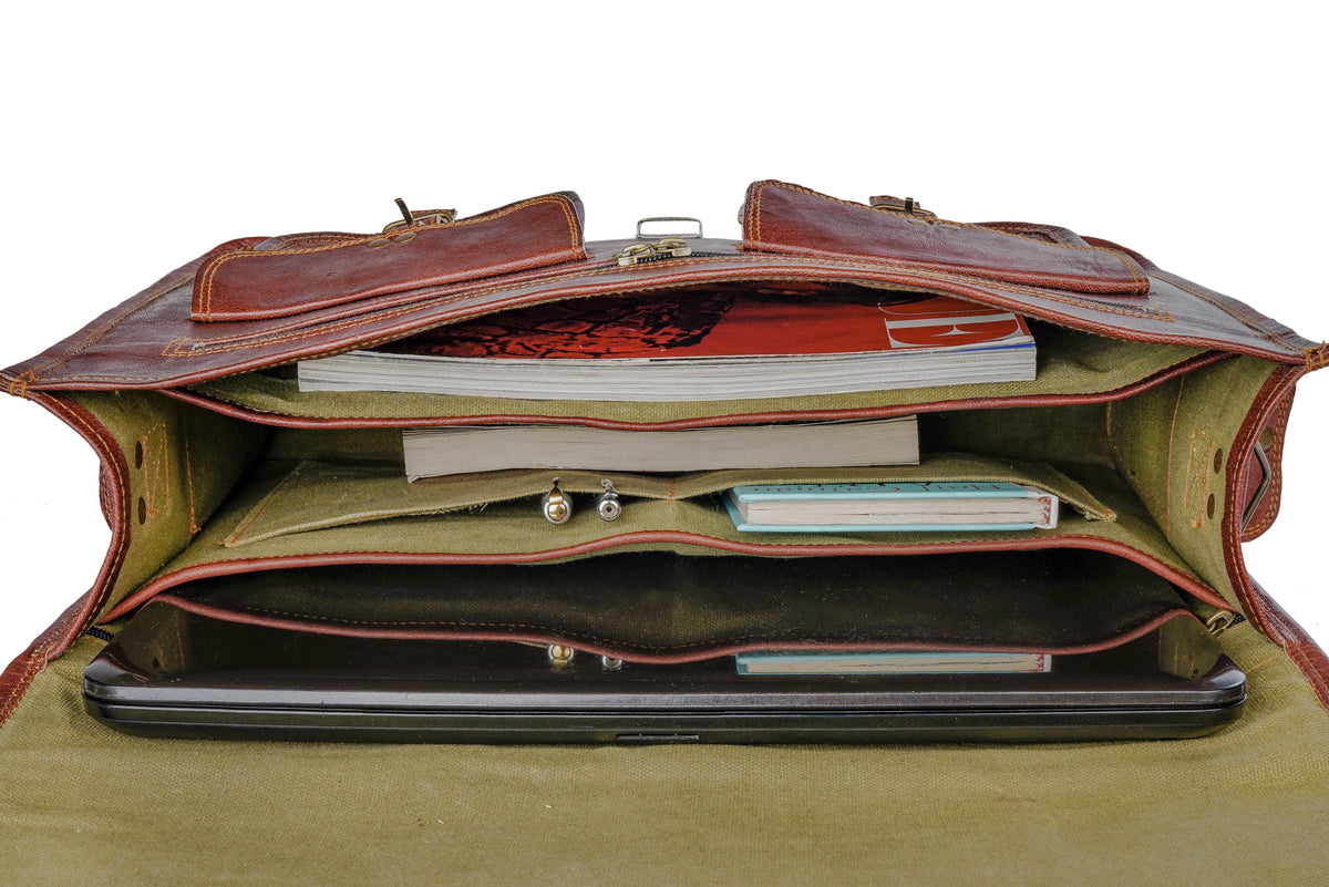 Open brown leather briefcase interior with zip pocket and document compartments