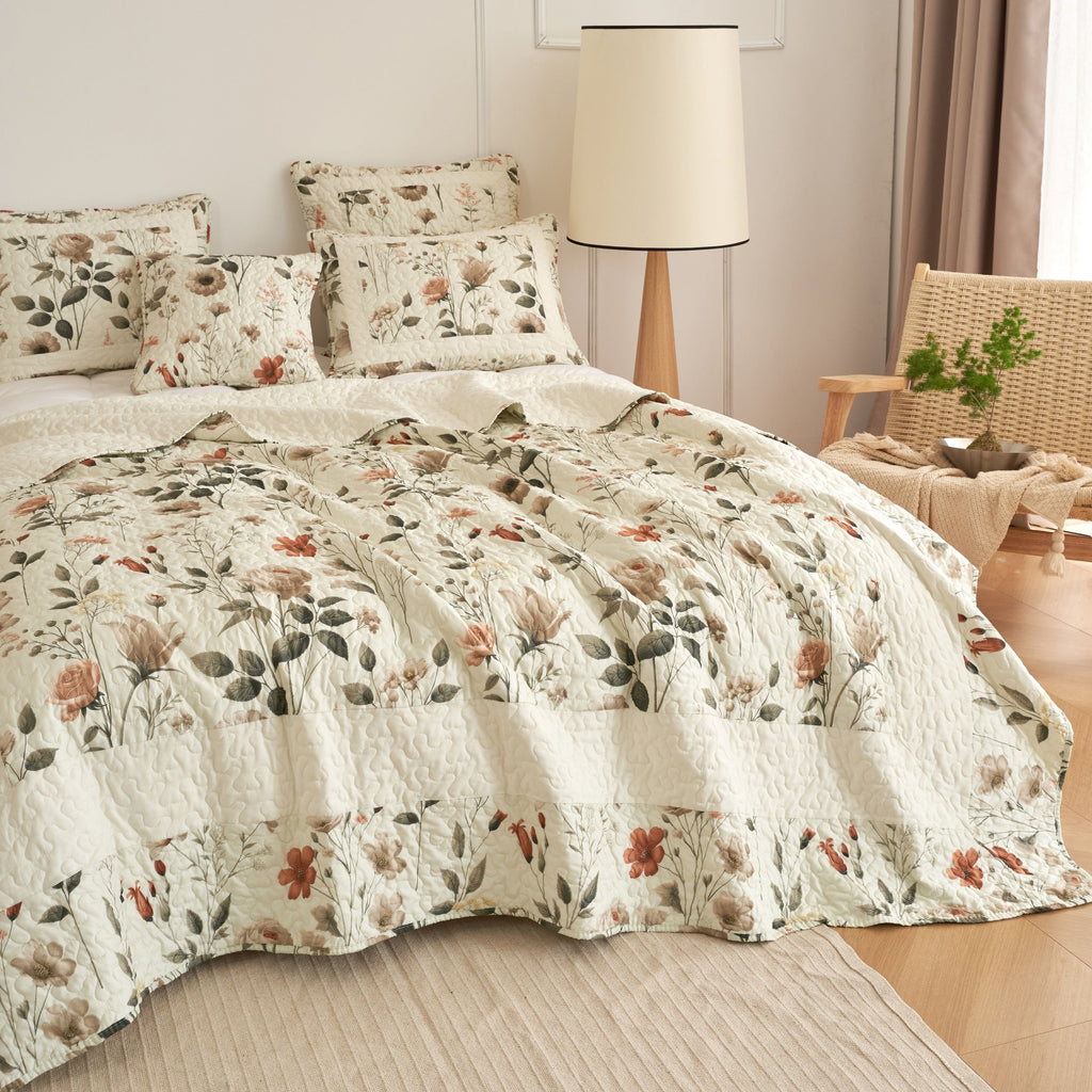 Floral quilt set showing cream quilt texture with botanical print and pillow shams