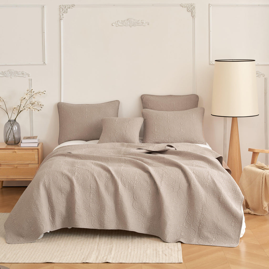 Quilted cotton bedspread set in neutral taupe with swirled matelasse texture