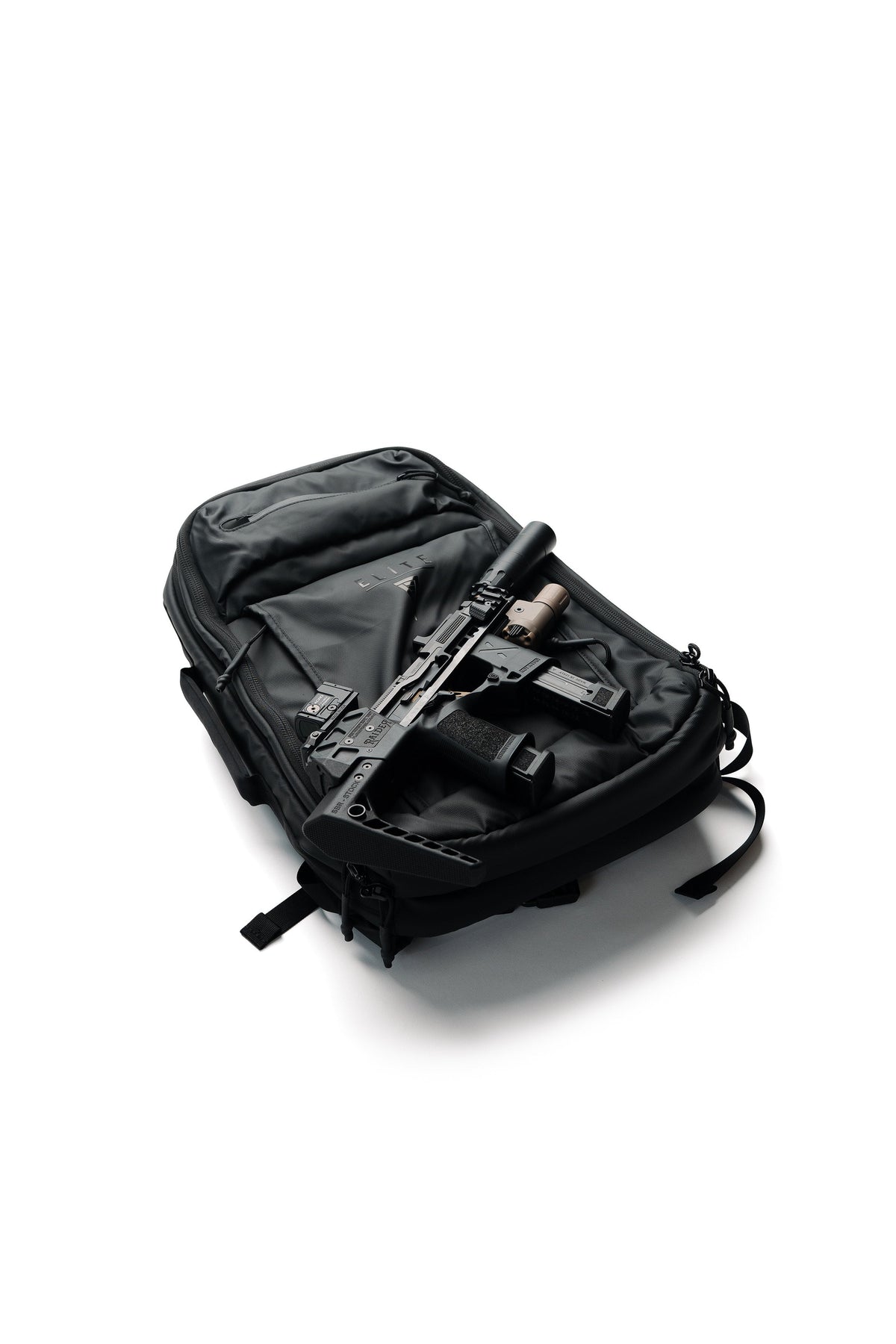 SBR backpack open flat, interior storage with organized compartments and zippered panels