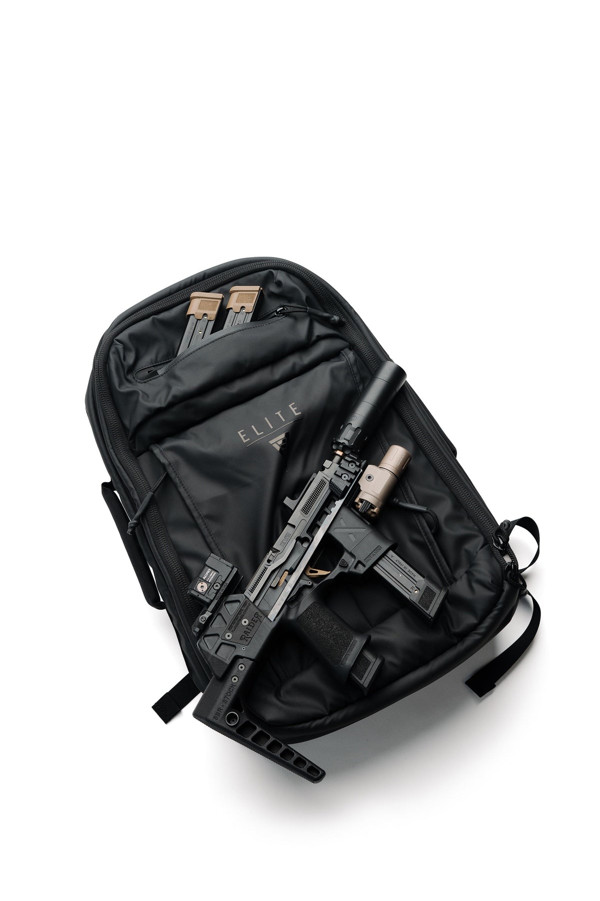 SBR backpack laid open, showing compartment with tactical gear and side retention straps