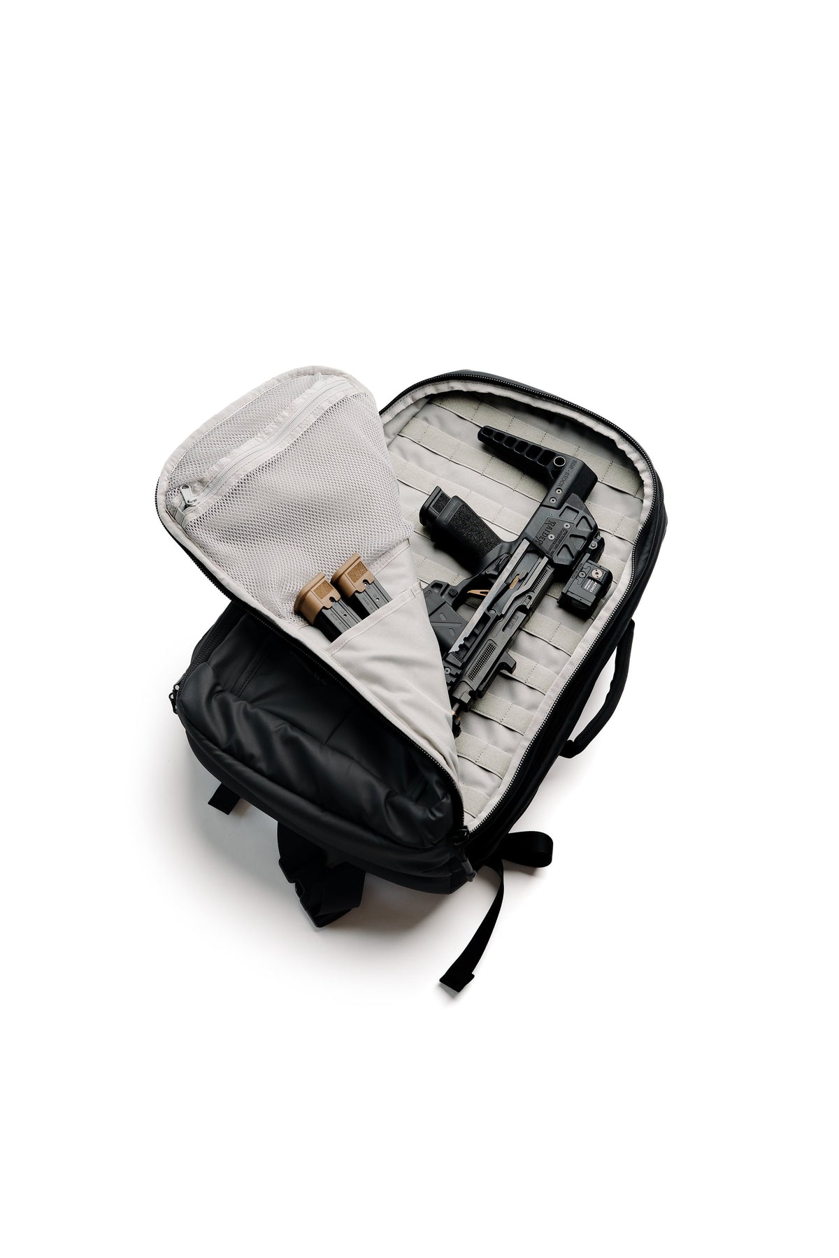 SBR backpack open with light gray inner lining, showing organized compartments and straps