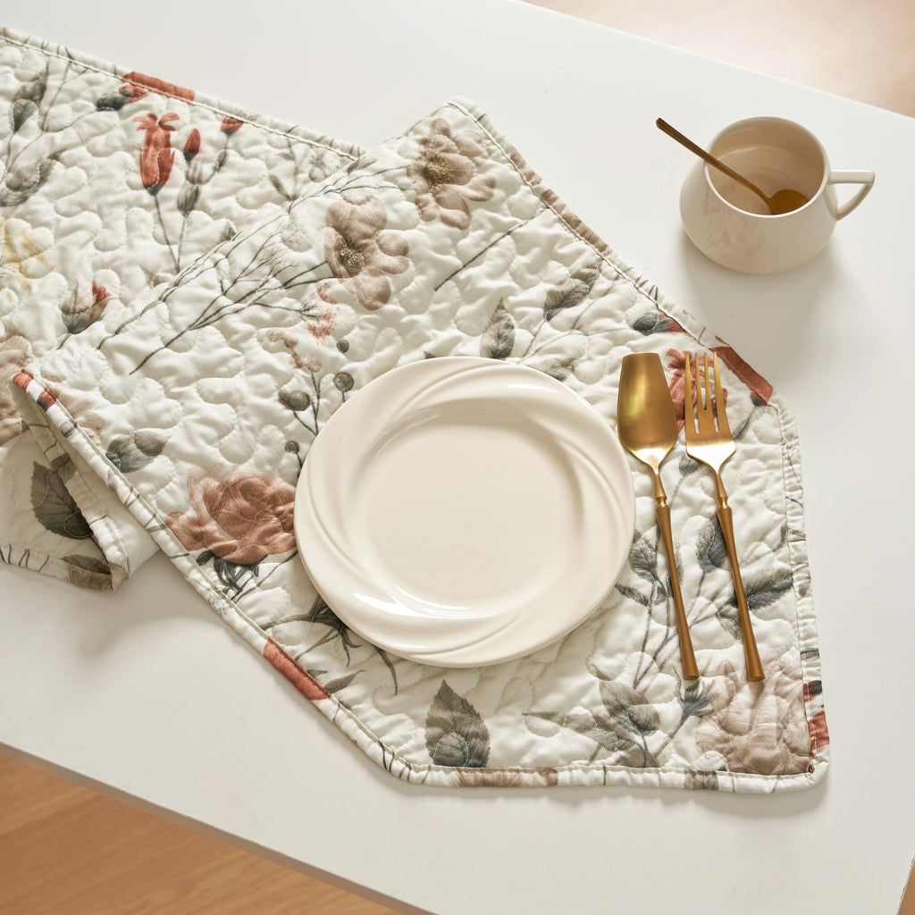 Quilted dinner table runner with stitched texture, beige floral print and stitched border