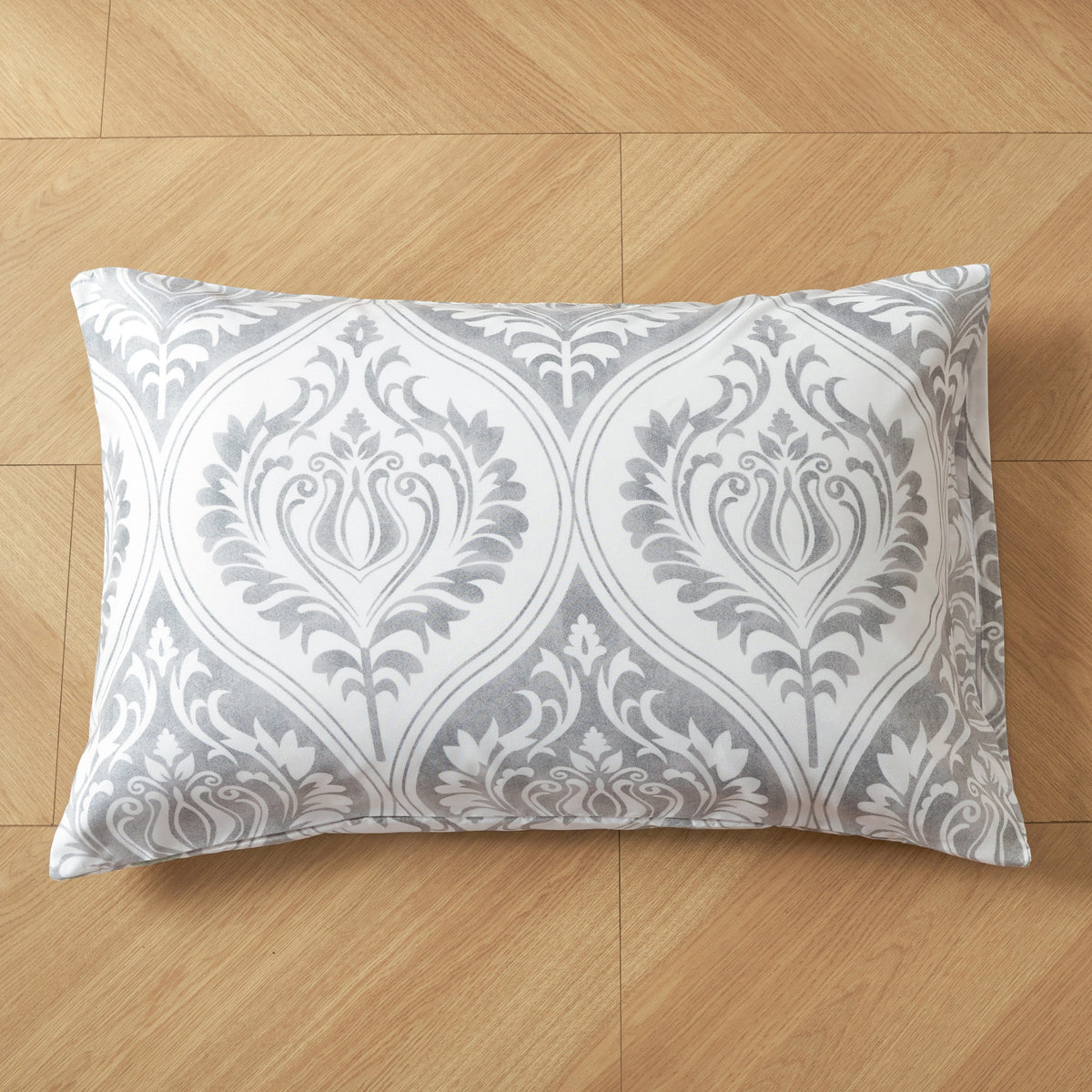 Gray and white damask ogee-pattern pillowcase with symmetrical swirl medallion print