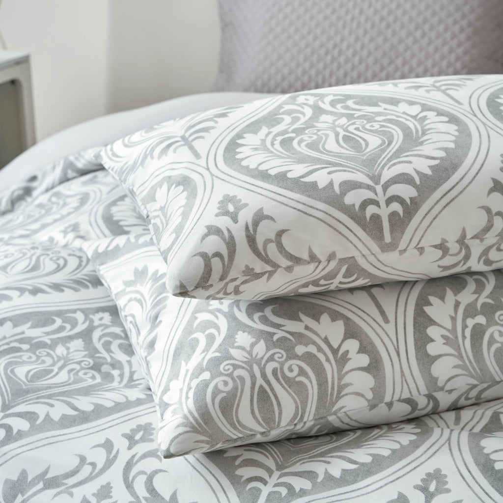 Gray and white damask ogee-pattern pillowcase with close-up of fabric design