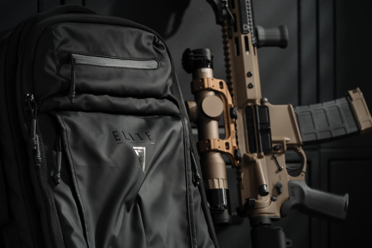 Black backpack with front zip pocket and side organizer panels