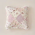 Blush quilted floral patchwork pillow cover with ruffled edges and heart seam detail