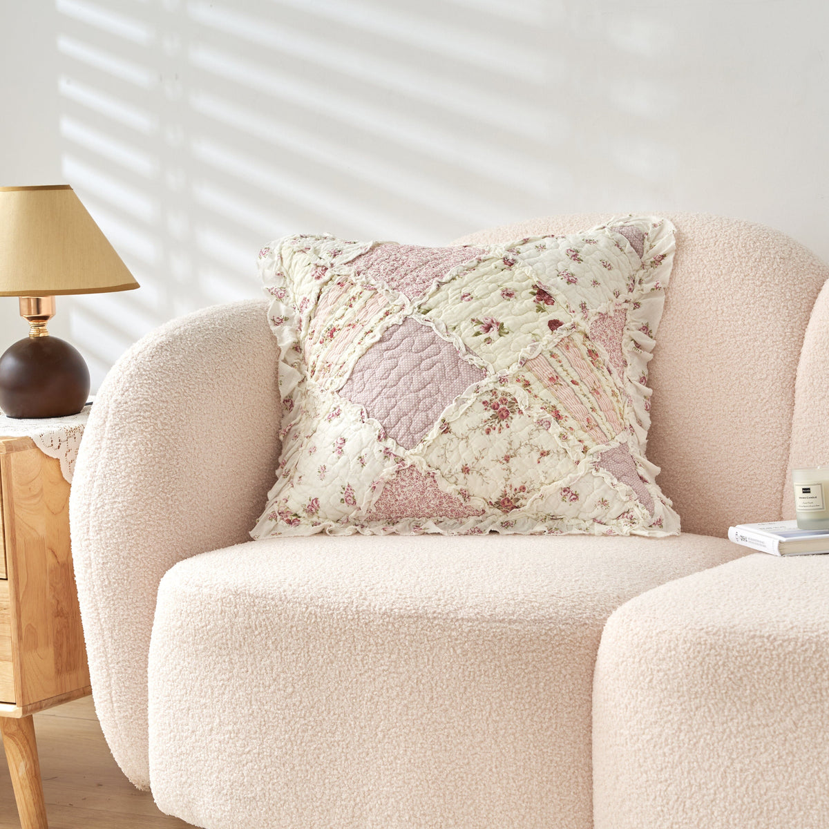 Square floral patchwork pillow cover with blush quilted fabric and braided heart seam