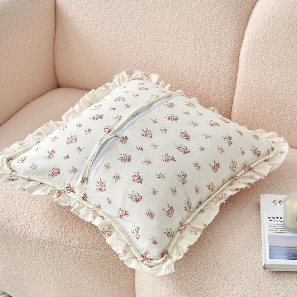 Ruffled quilted floral pillow cover with small rose print on cream fabric