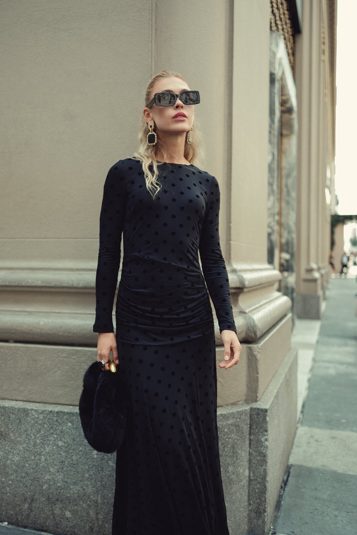 Black mesh dot maxi dress with long sleeves and ruched front, side view