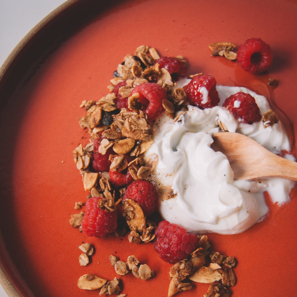 Vanilla bean granola with sour cherries and yogurt in a bowl