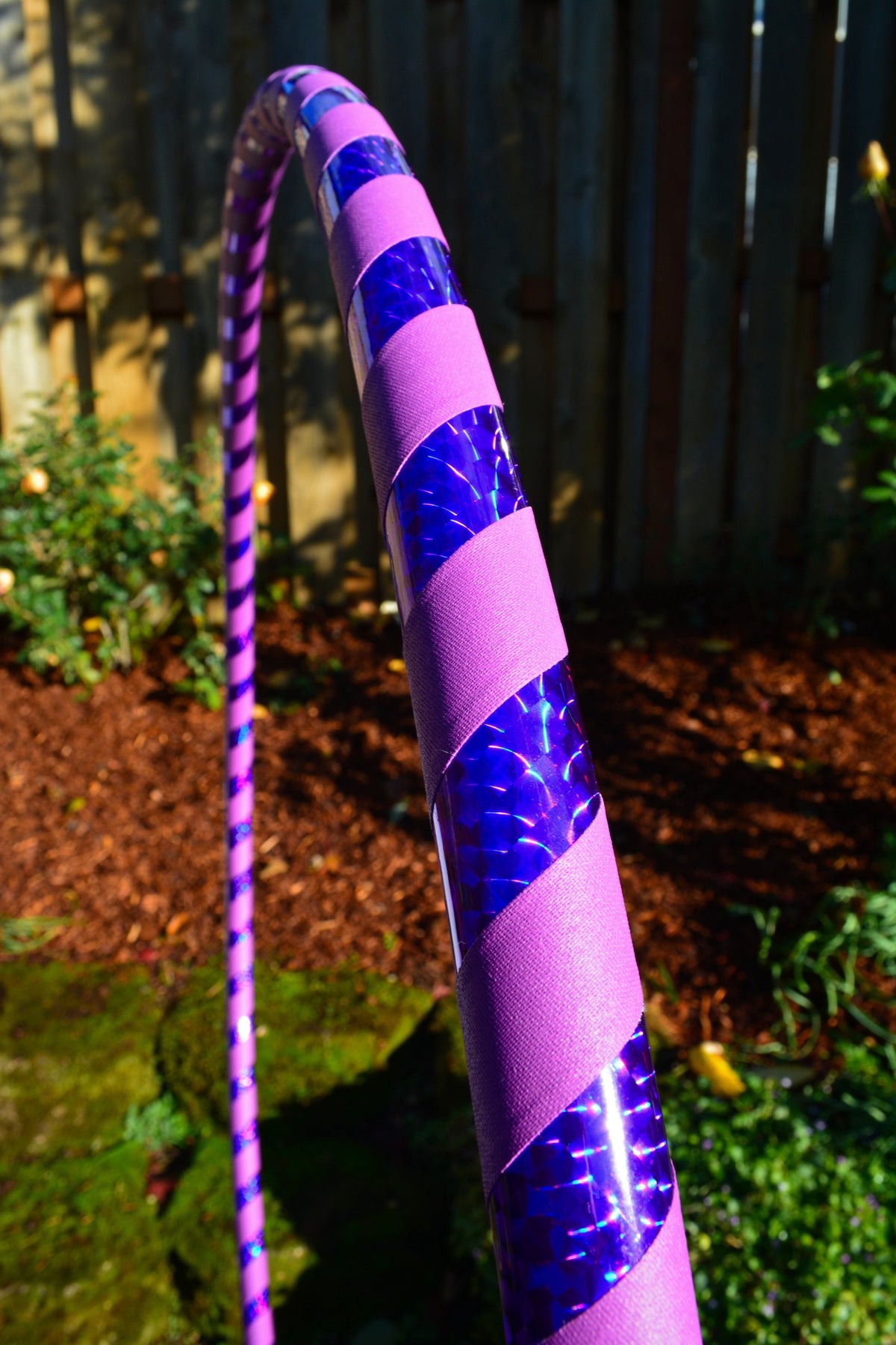 Purple holographic taped hula hoop with glittery reflective band sections