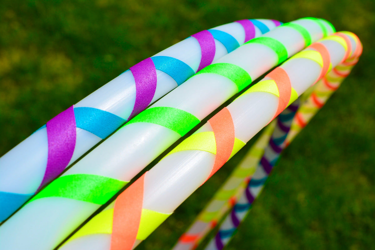 Beginner hula hoop with glossy multicolor spiral gaffer tape ribbon close-up