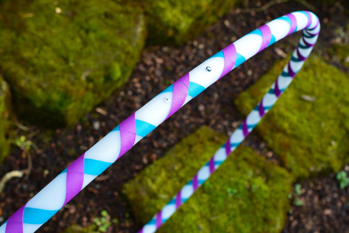 Beginner hula hoop with spiral colored gaffer tape, purple and blue tubing loop