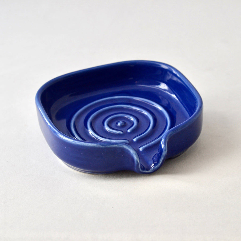 Cobalt blue porcelain self-draining soapdish with side spout and swirl well