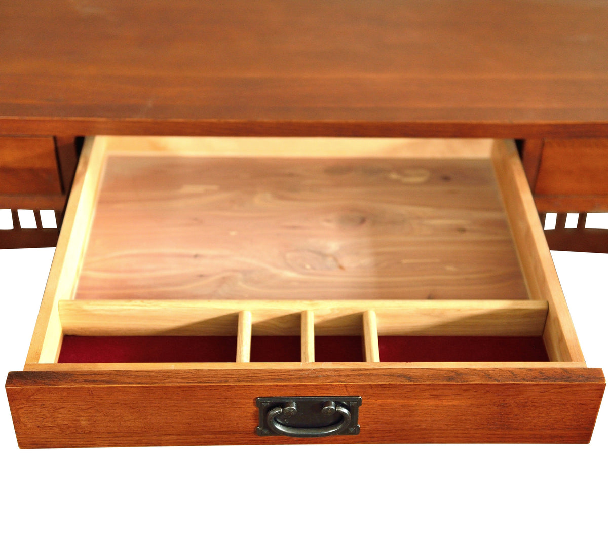 Open drawer compartment of a wood library desk with built-in divider and metal pull handle.