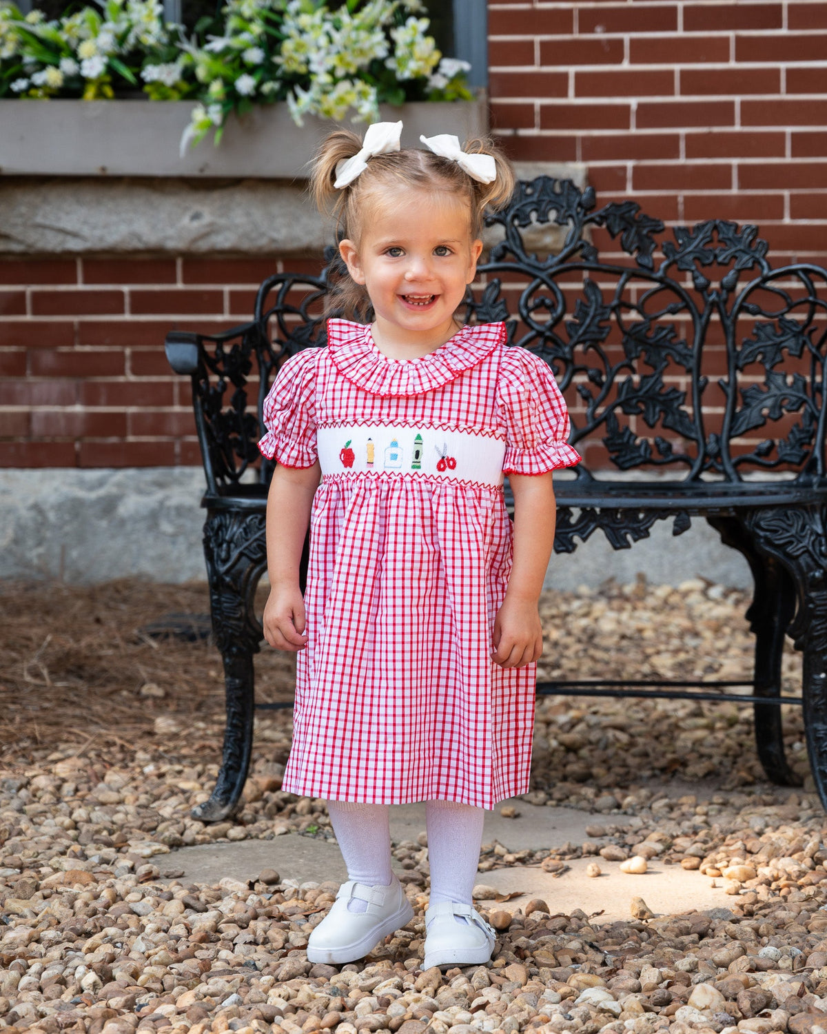 Red and white windowpane smocked dress with embroidered village panel and puff sleeves