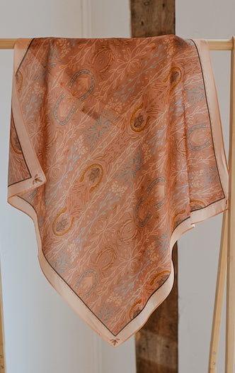 Dusty rose wild rag scarf with paisley and floral motifs, folded triangular shape