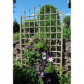 Mocha brown vinyl trellis panel with lattice grid and vertical rails for wall mounting