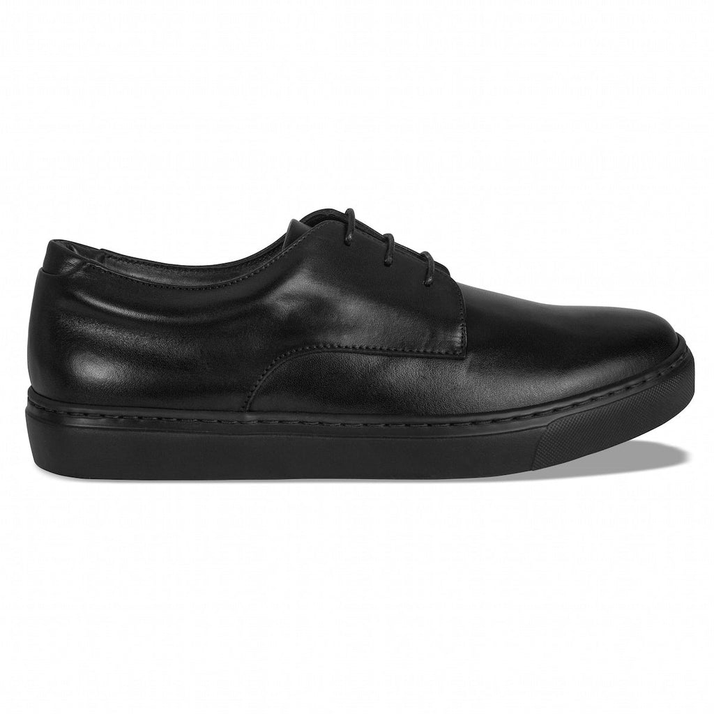 Black lace-up oxford shoes with side stitching and platform rubber sole.