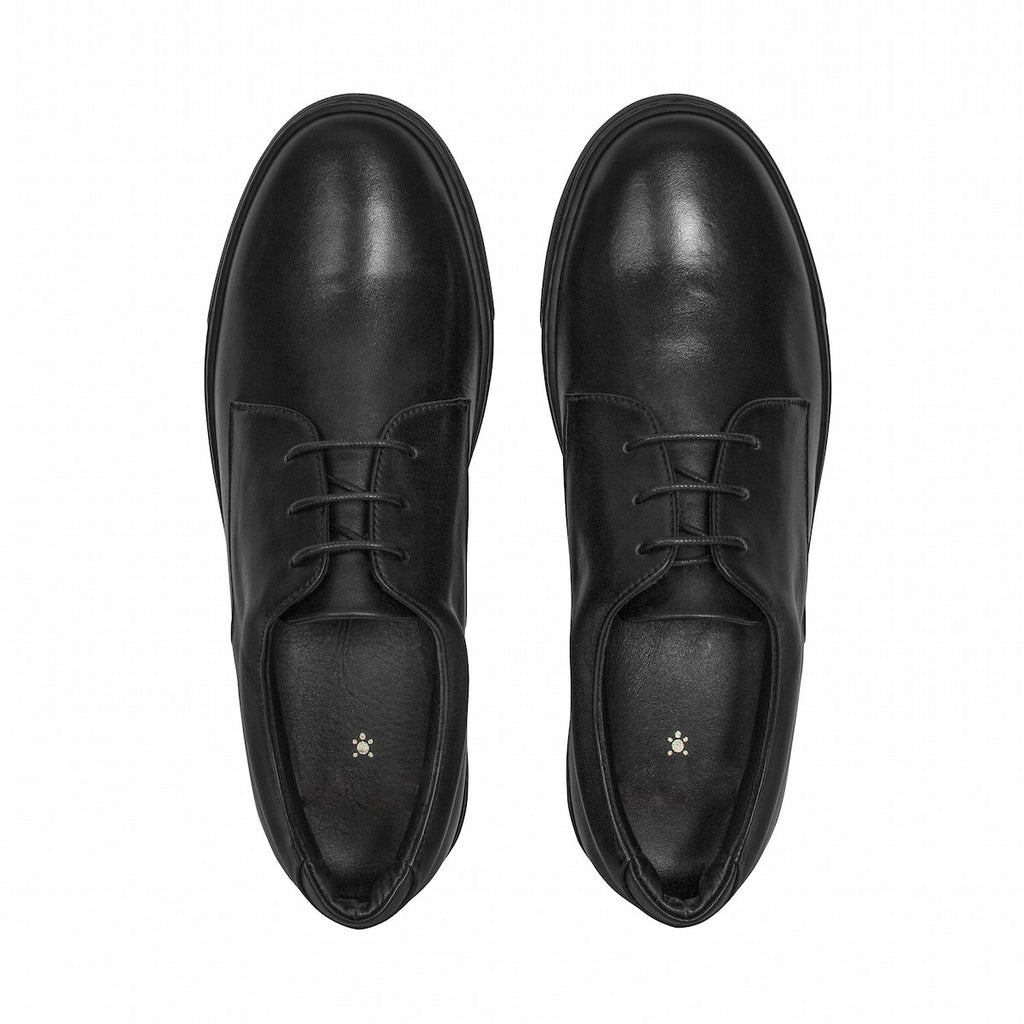 Pair of black leather oxfords, front view, lace-up with rounded toe.