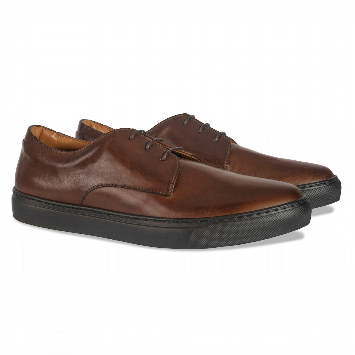 Brown leather lace-up dress shoe with apron stitching and textured dark sole