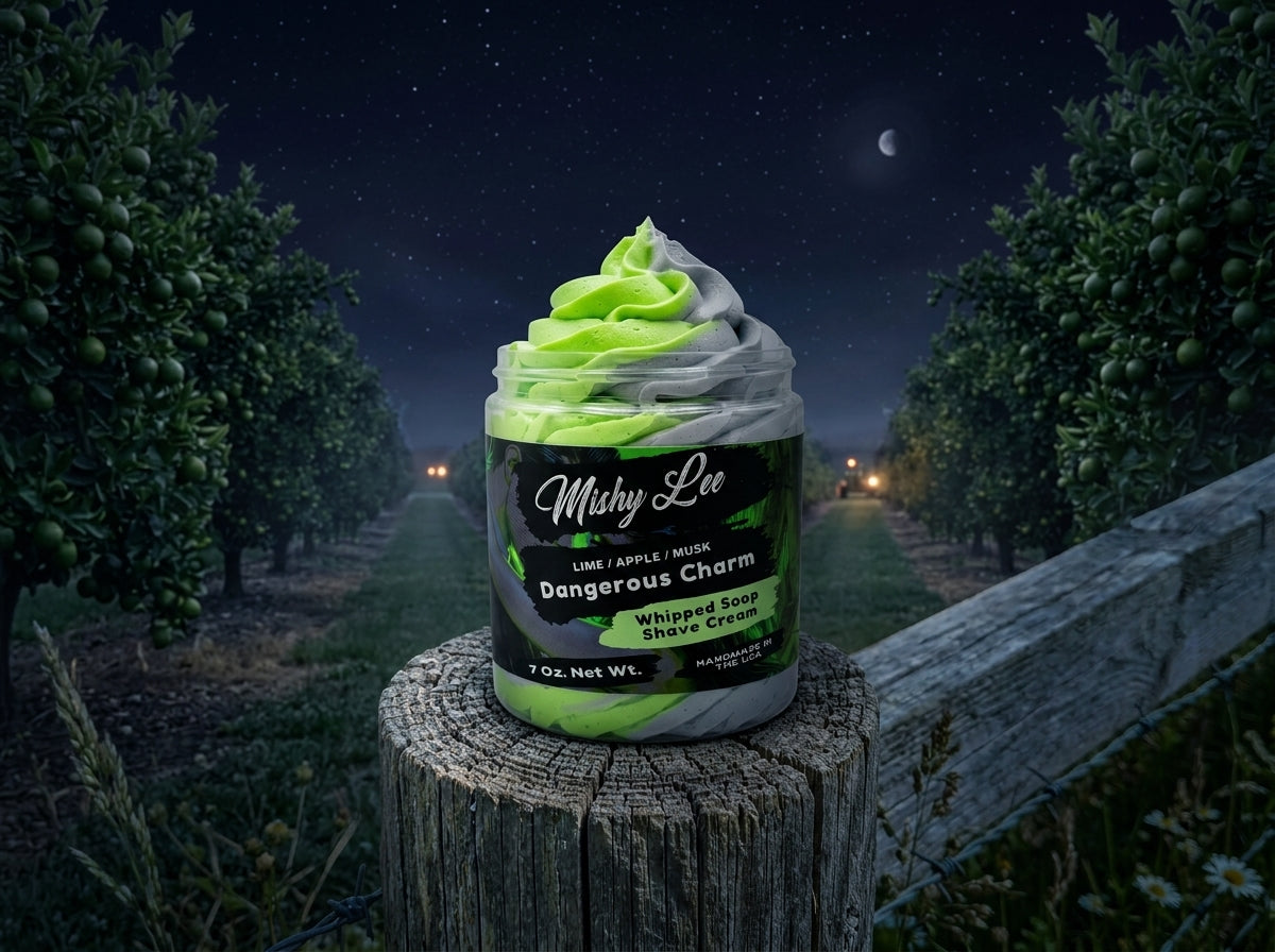 Whipped soap and shave cream jar on a stump with green and gray whipped swirl
