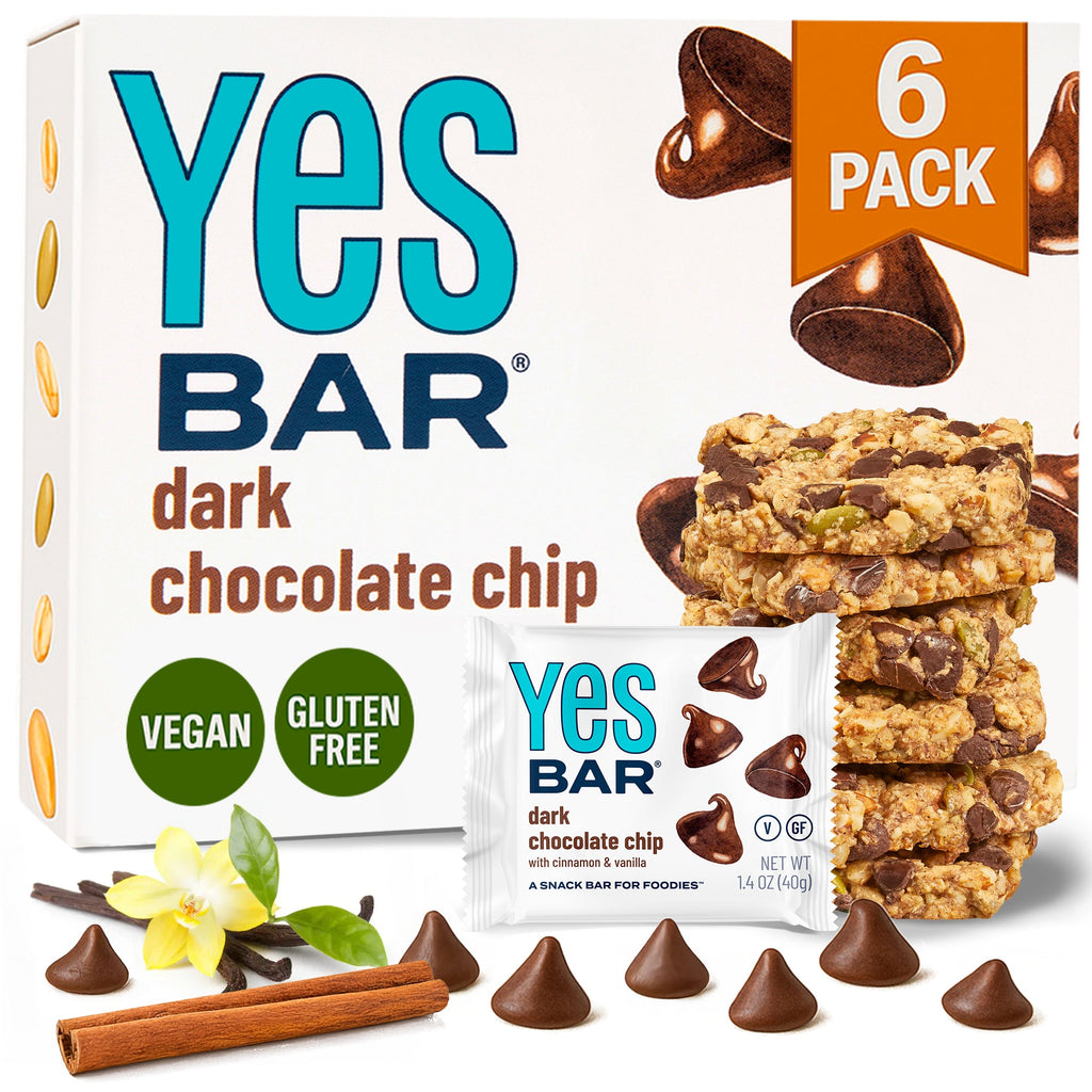 Yes Bar dark chocolate chip 6-pack box with stacked bars and scattered chocolate shapes