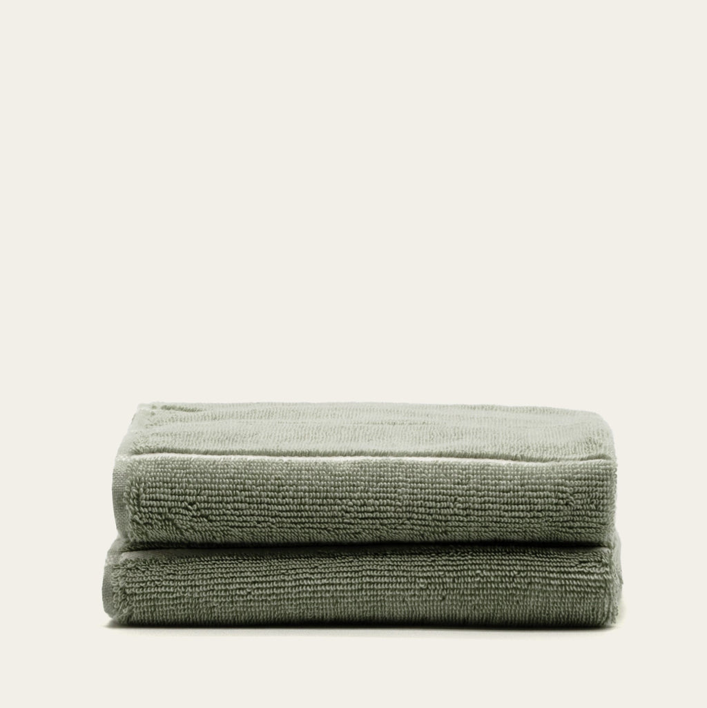 Sage green cotton towels, folded stack of two
