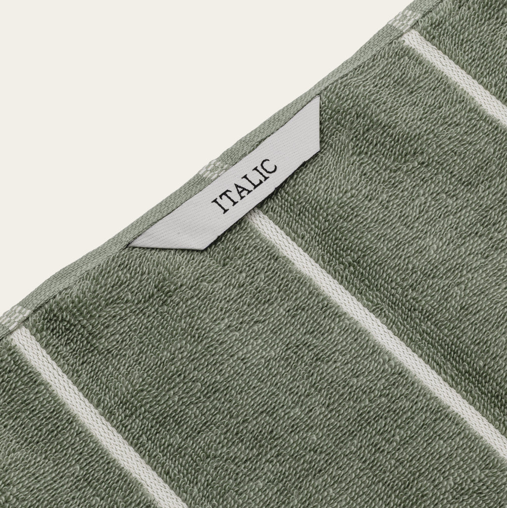 Sage green towel border with white woven trim