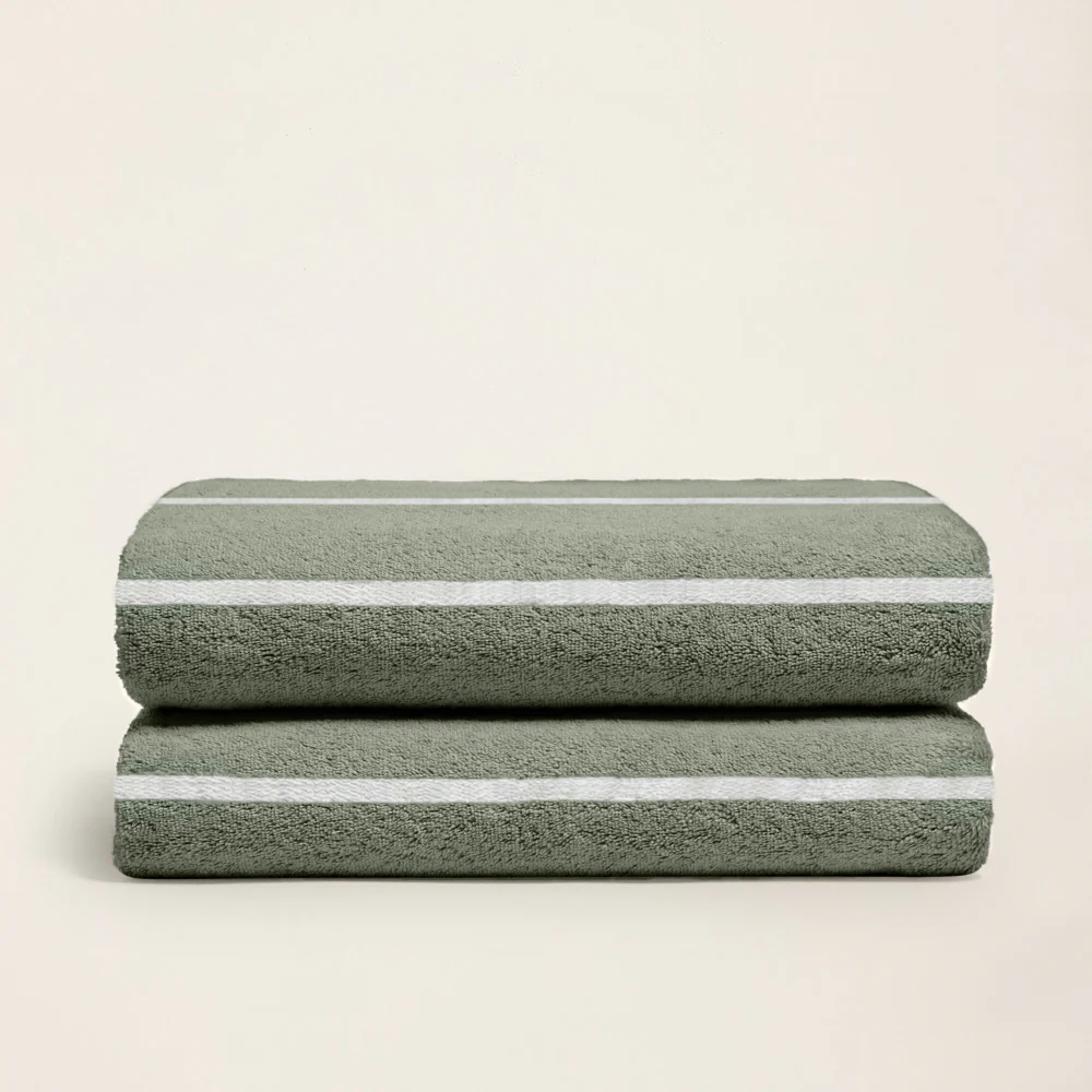 Sage green cotton towels with horizontal white stripes, two-piece stack
