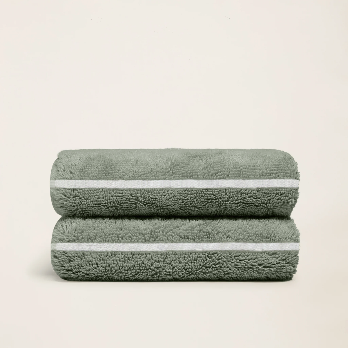 Sage green cotton towels set, folded terry with two horizontal white stripe bands