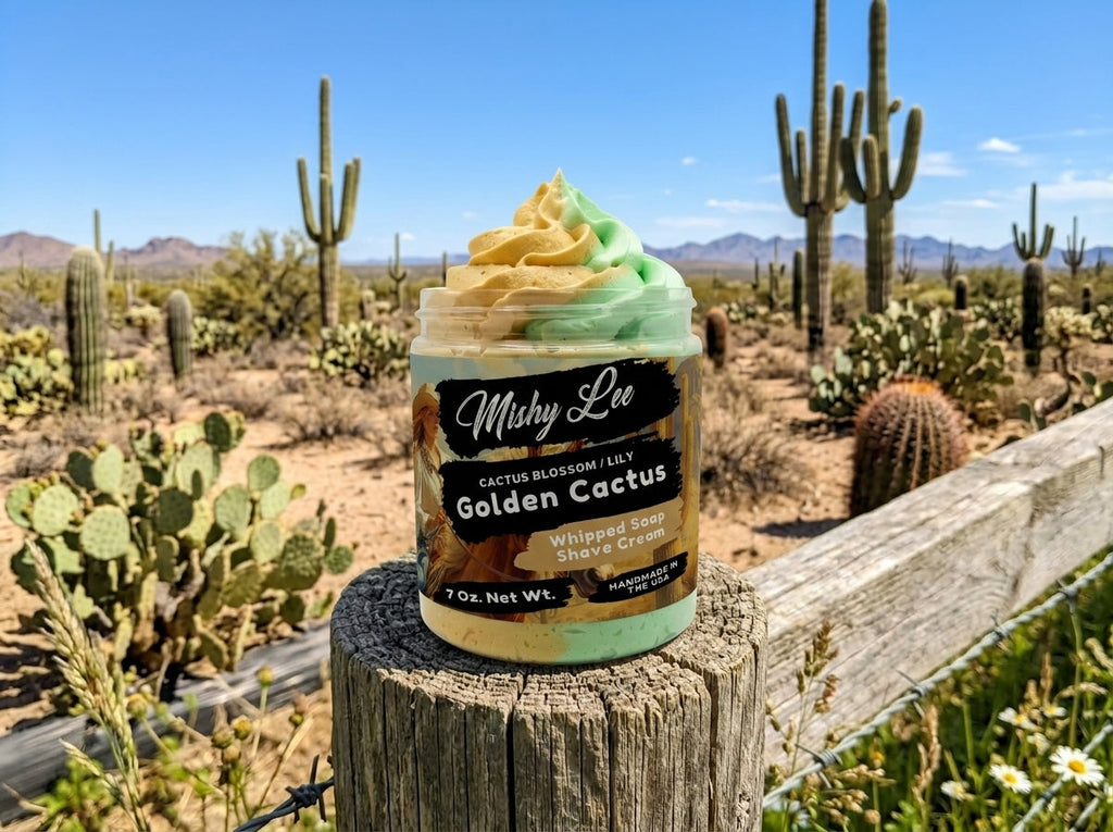 Whipped soap and shave cream jar on stump outdoors with gold-and-green swirl topping