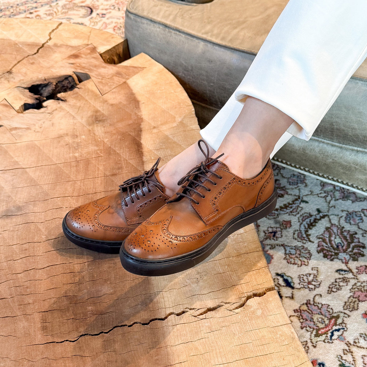 Women's cognac lace-up oxford shoes with brogue detailing and black rubber sole