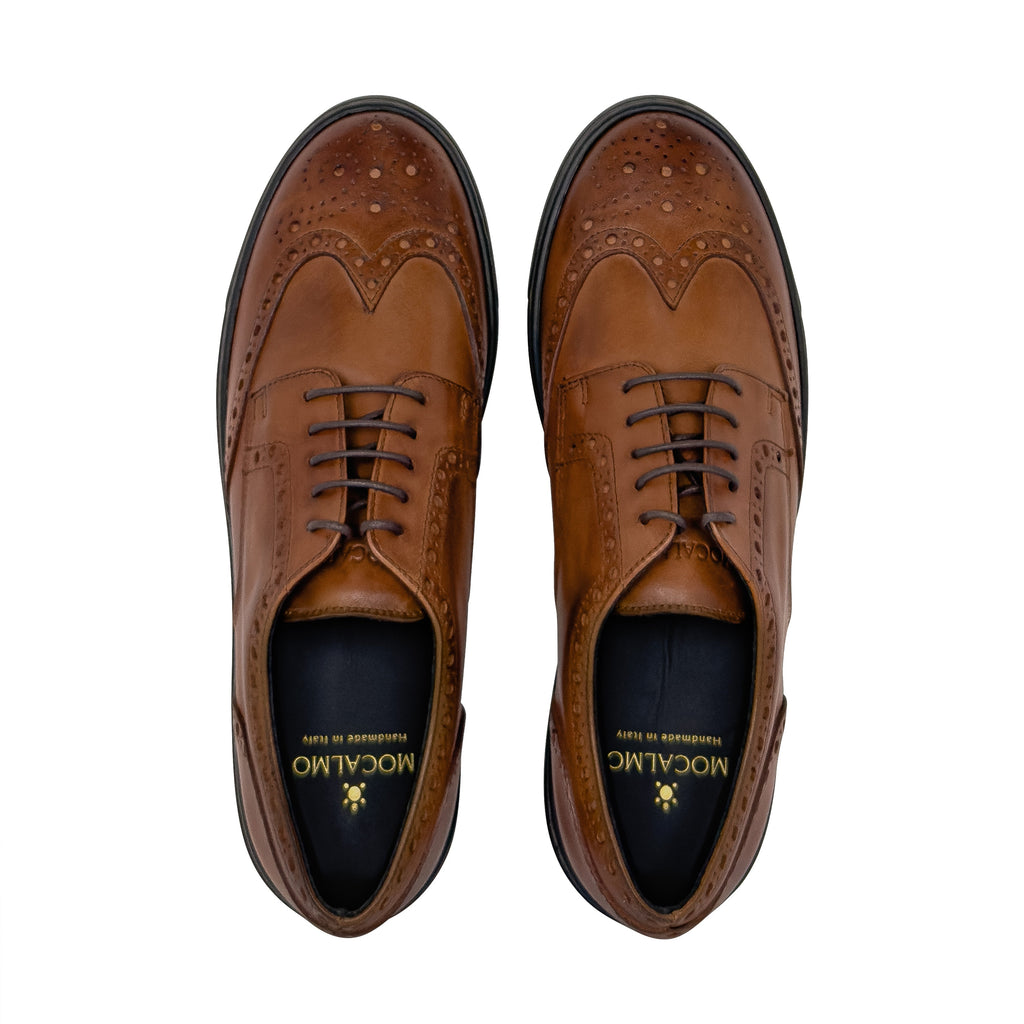 Women’s cognac lace-up leather oxford shoes with dark rubber sole and stitched detailing