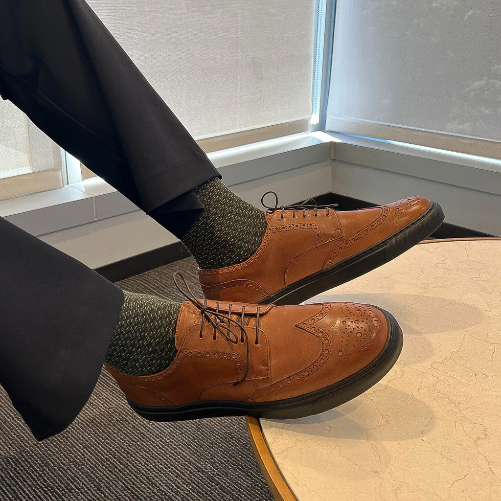Cognac lace-up wingtip oxford shoes with black soles