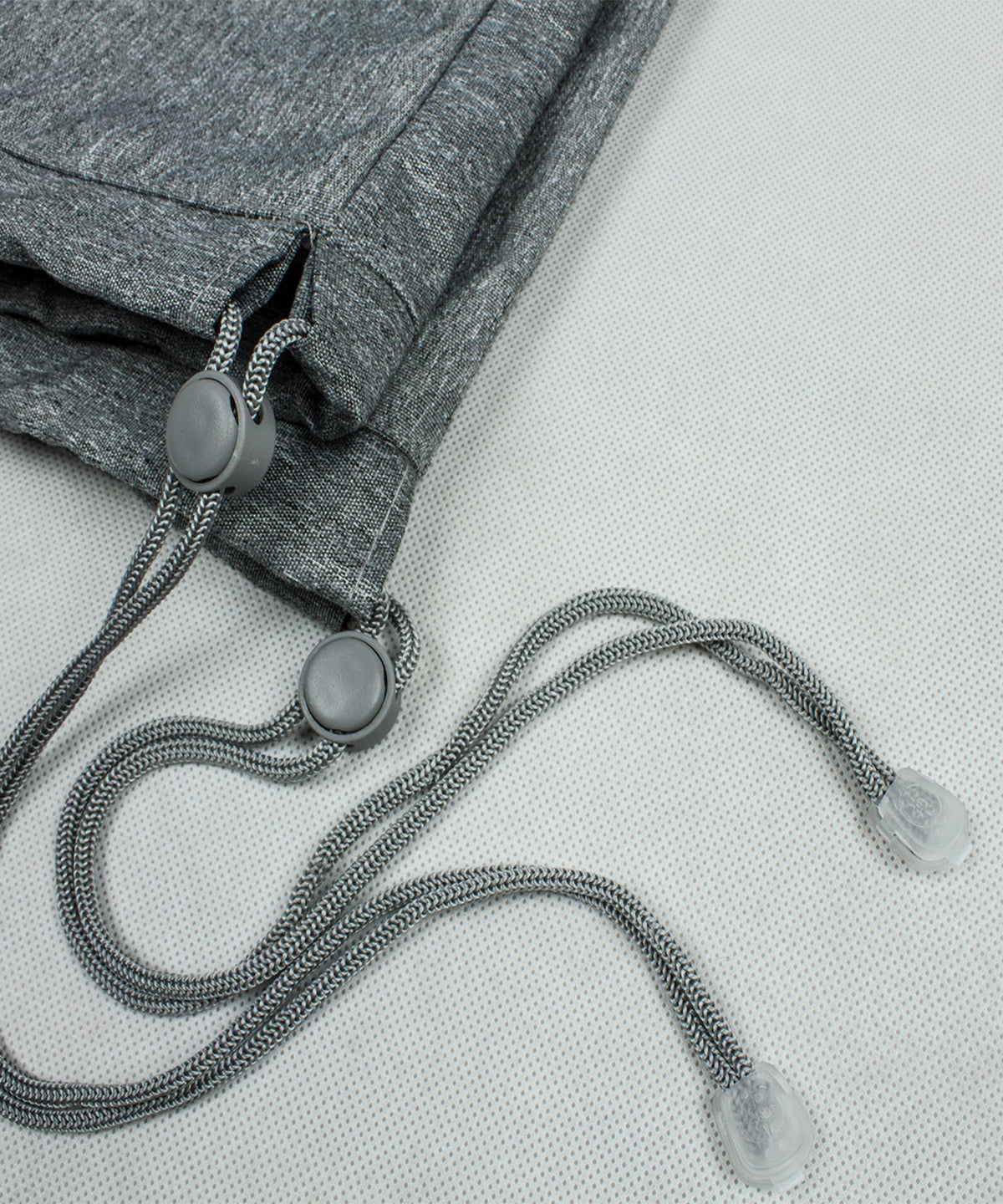Grey cover edge with drawstring, toggle ring, and metal eyelets