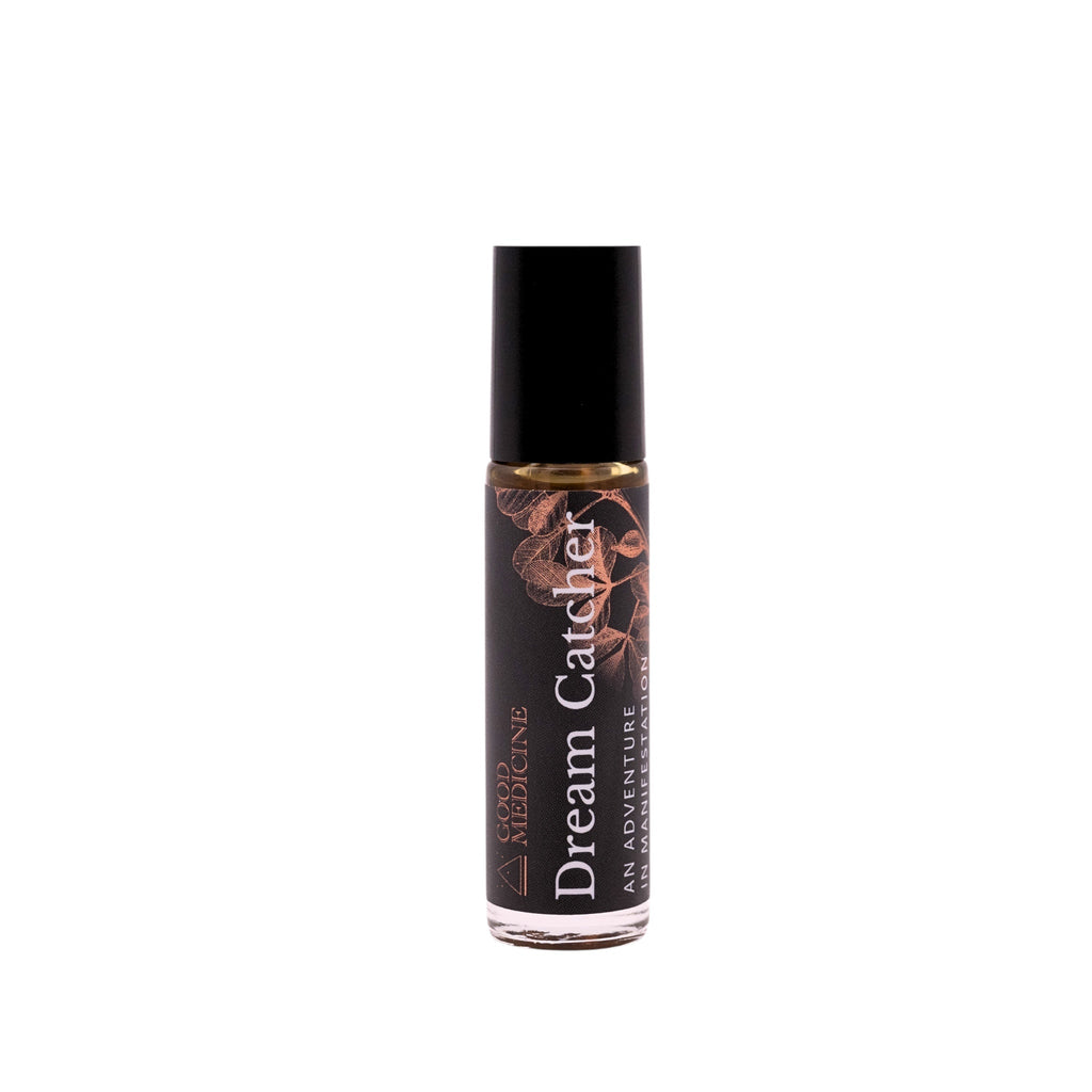 Botanical perfume roller bottle with black cap and brown floral label