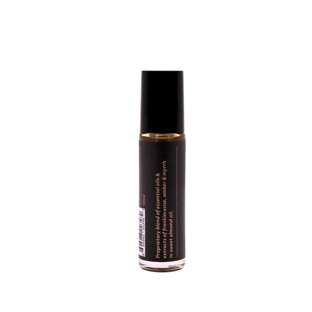 Botanical perfume roller bottle with black cap and side label