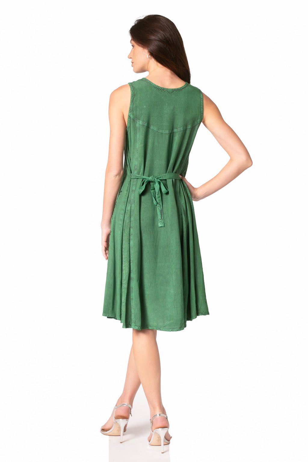 Green sleeveless midi dress back view with adjustable tie at waist and embroidered fabric.