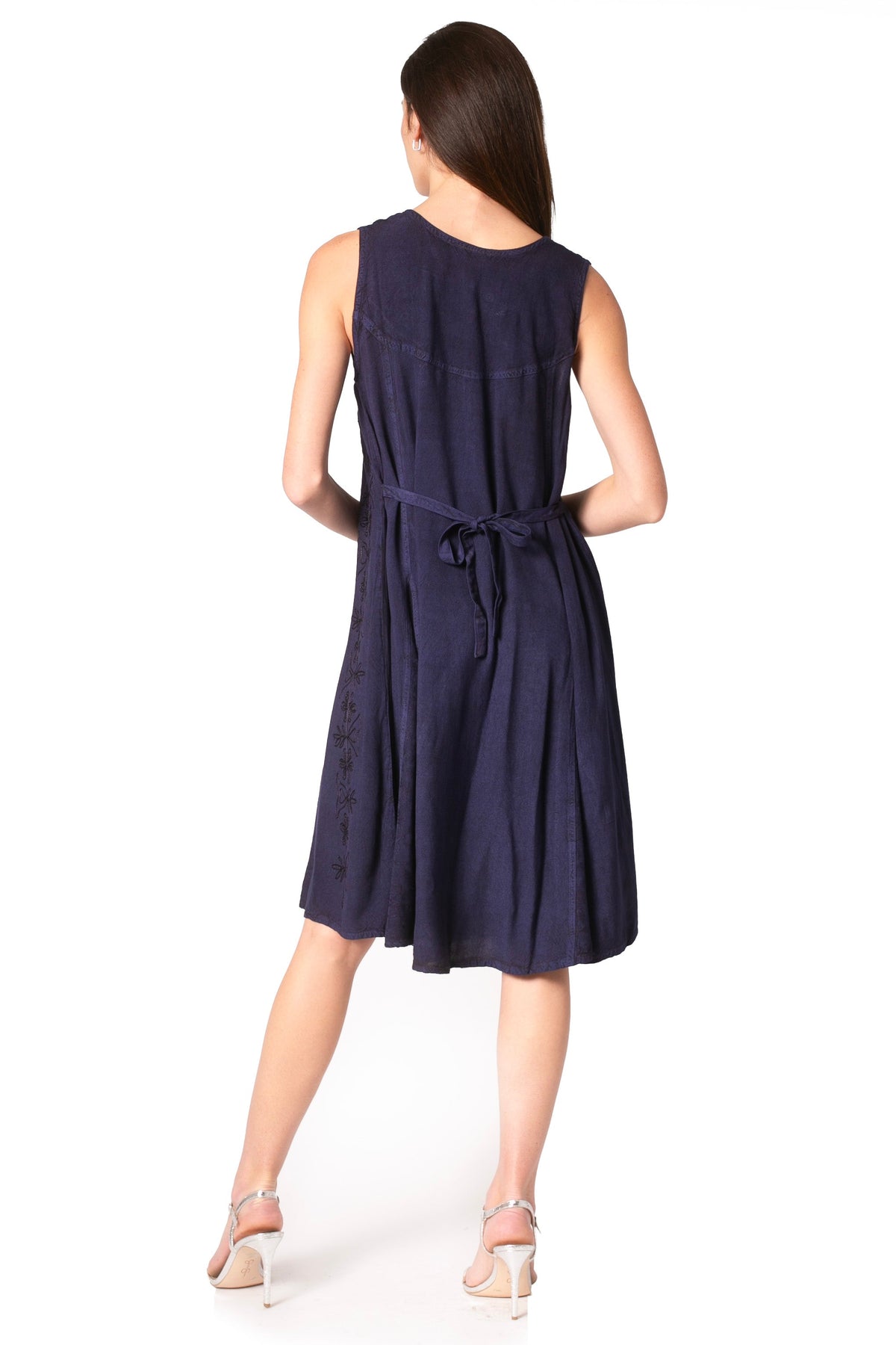 Navy sleeveless midi dress back view with tie waist and embroidered fabric texture.