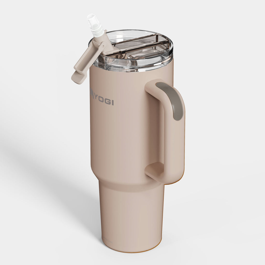 Ceramic-lined tumbler with open clear lid, side handle, cream body