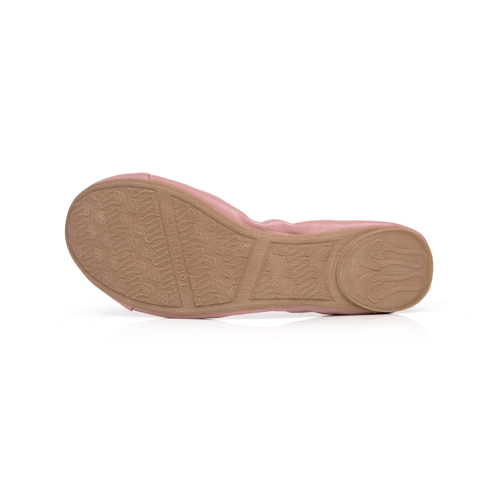 Dusty rose flat shoe sole with textured grip and stitched edge
