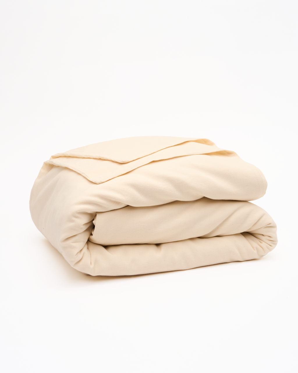 Cream folded bedding set: duvet cover with fitted sheet and pillowcase