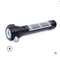 Black LED flashlight with textured grip and lanyard loop