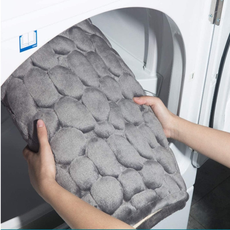 Gray bathroom bath mat with raised pebble-texture dots, non-slip backing